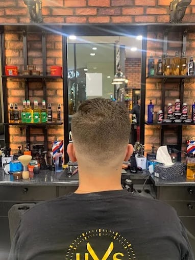 Barber station mirror with grooming products