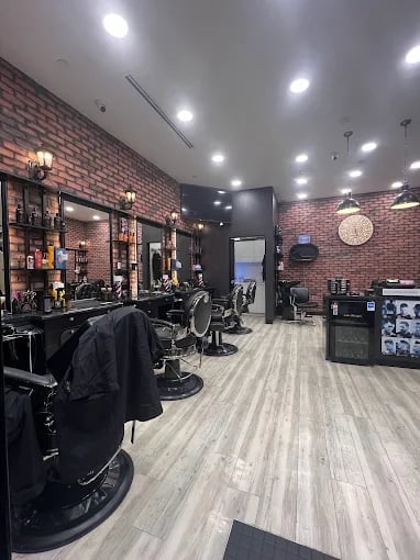 HVS Brothers barbershop interior with brick walls and pendant lighting